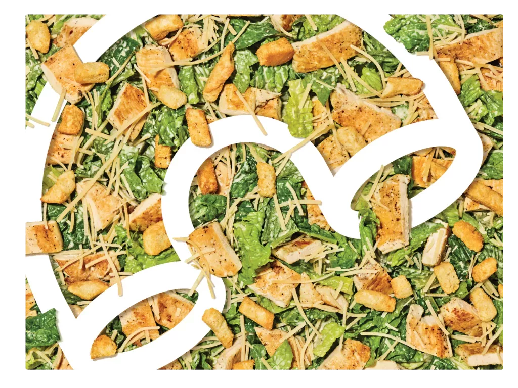 Noodles &amp; Company Caesar Salad Close Up with Logo