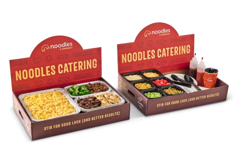 Noodles &amp; Company mac and cheese pan with variety of toppings and sauces.